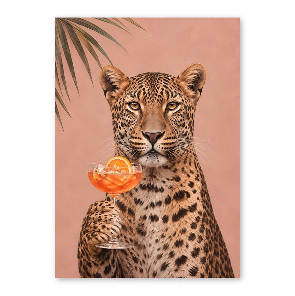 A leopard facing forward holding an orange cocktail with an orange slice, against a dusty pink background with palm fronds
